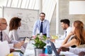 Caucasian Businessman Leading Meeting At Boardroom Table Royalty Free Stock Photo