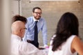 Caucasian Businessman Leading Meeting At Boardroom Table Royalty Free Stock Photo