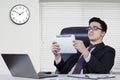 Caucasian businessman looking at tablet in office Royalty Free Stock Photo