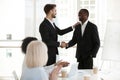 Caucasian boss handshake black employee greeting with success Royalty Free Stock Photo