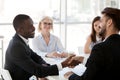 Diverse employees handshake greeting at office meeting Royalty Free Stock Photo