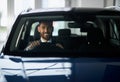 Businessman choosing new luxury car at modern salon Royalty Free Stock Photo