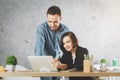 Caucasian businessman and woman working on project