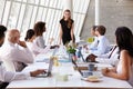 Caucasian Businesswoman Leading Meeting At Boardroom Table Royalty Free Stock Photo