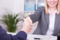 Caucasian businesswoman offers cooperation with a handshake Royalty Free Stock Photo