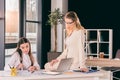 Caucasian businesswomen in formalwear talking while working at modern office Royalty Free Stock Photo