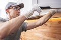 Caucasian Cabinetmaker Assembling Kitchen Cabinets