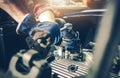 Car Mechanic Performing Classic Car Engine Maintenance