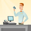 Caucasian cashier holding a credit card. Royalty Free Stock Photo