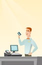 Caucasian cashier holding a credit card. Royalty Free Stock Photo