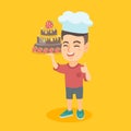 Caucasian child in chef hat holding a cake.