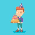 Caucasian child holding birthday cake with candles Royalty Free Stock Photo