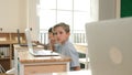 Caucasian child programing software system and learning about coding. Pedagogy. Royalty Free Stock Photo