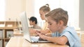Caucasian child programing software system and learning about coding. Pedagogy. Royalty Free Stock Photo