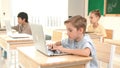 Caucasian child programing software system and learning about coding. Pedagogy. Royalty Free Stock Photo