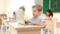 Caucasian child programing software system and learning about coding. Pedagogy. Royalty Free Stock Photo