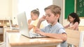 Caucasian child programing software system and learning about coding. Pedagogy. Royalty Free Stock Photo