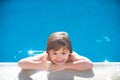 Caucasian child in swimming pool. Kids thumbs up. Kid relax in pool side. Royalty Free Stock Photo