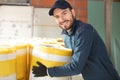 caucasian construction worker with roll insulating material