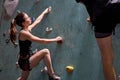 Caucasian couple climbers. Extreme indoor climbing. Strong woman and man