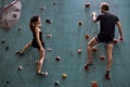Caucasian couple climbers. Extreme indoor climbing. Strong woman and man Royalty Free Stock Photo