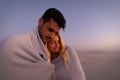 Caucasian couple enjoying time at the beach during the sunset Royalty Free Stock Photo