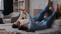 Caucasian couple family woman wife and man husband lying upside down on cozy bed in bedroom relax together rest weekend Royalty Free Stock Photo