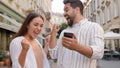 Caucasian couple happy woman man rejoices winning victory lucky expression together joy using mobile phone cellphone Royalty Free Stock Photo