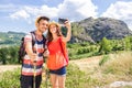 Loving couple of hikers taking a selfie on vacation