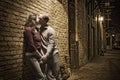 Caucasian couple kissing in brick alley way