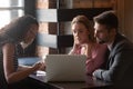 Caucasian couple meeting in cafe with female realtor Royalty Free Stock Photo