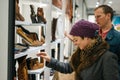 Heterosexual caucasian couple shoe shopping in a boutique shop