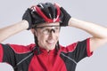 Caucasian Cyclist Checking Road Helmet Royalty Free Stock Photo