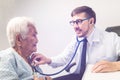 Caucasian doctor examination elderly women