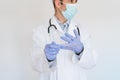 Caucasian doctor using protective gloves. Chinese Corona virus concept