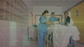 Caucasian doctors walking with patient in bed over cardiograph