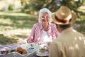 Caucasian elderly couple enjoy outdoor, having breakfast and coffee Royalty Free Stock Photo