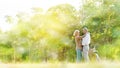 Caucasian elderly couples come to happy in park during the summer. Of long holidays and Picnic. Tourism activities Of retire. Frie Royalty Free Stock Photo