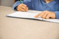 Caucasian elementary school child doing homework at the end of the school day. Royalty Free Stock Photo