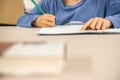 Caucasian elementary school child doing homework at the end of the school day. Royalty Free Stock Photo
