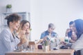 Caucasian employees eating lunch Royalty Free Stock Photo