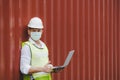 Caucasian engineer control worker wearing protection face mask working on digital laptop computer Royalty Free Stock Photo