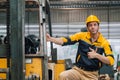 Caucasian engineer using a laptop in a factory. man working in plastics factory