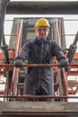 Caucasian engineer at work at container yard and cargo with containers forklift