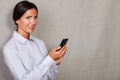 Caucasian ethnicity lady holding mobile phone