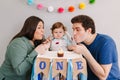 Mother father dad taking selfie with child kid toddler. Caucasian family with baby boy celebrating first birthday at home. Cupcake Royalty Free Stock Photo