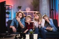 Caucasian family of four feeling bored while watching TV