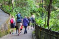 Caucasian family hiking with Infants in baby carrier, toddlers & kids along Lugard road, Victoria Peak, Hong Kong during covid-