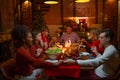 Caucasian family join dinner and pray together before start to celebration in Christmas holiday at night