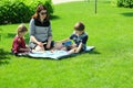 Caucasian family playing board games at the picnic outdoor Royalty Free Stock Photo